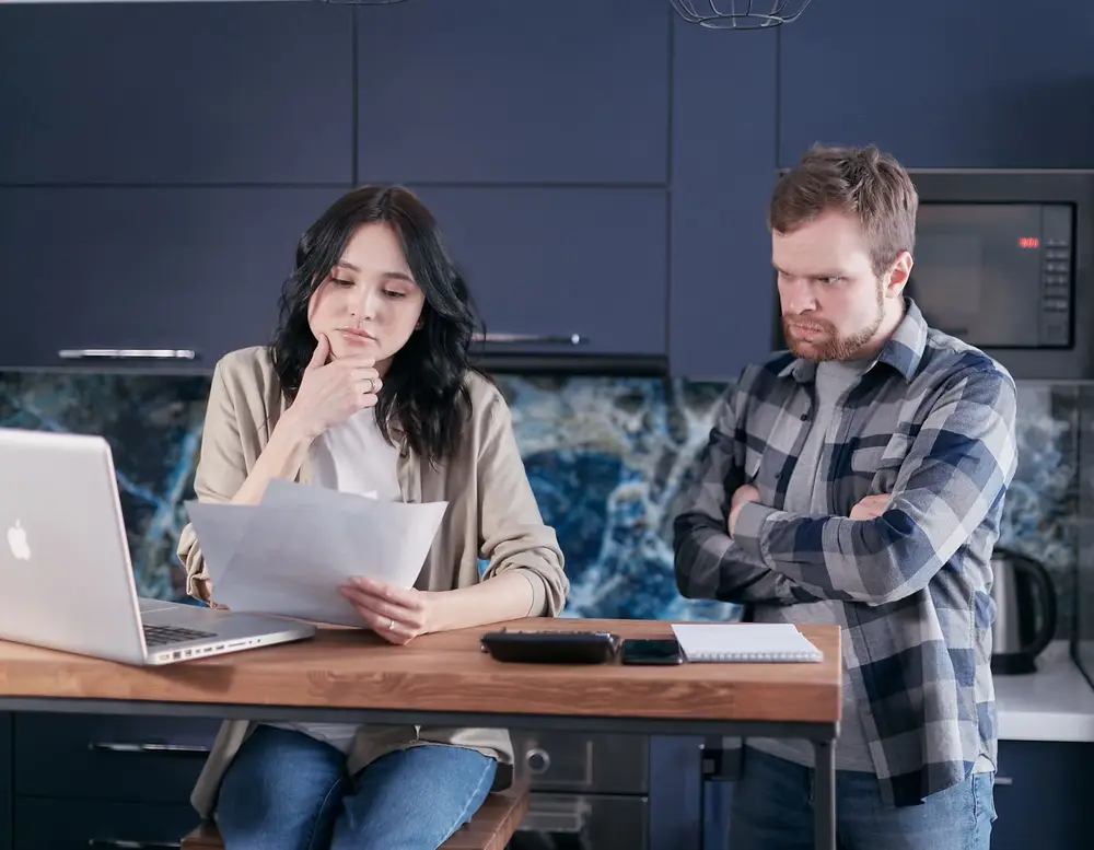 A person relaxing at home after sending a loan request